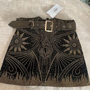 Black and gold studded mini skirt